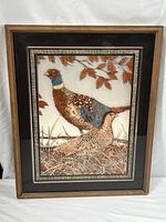 Full view of the framed reverse glass painting featuring two pheasants with a wooden frame.