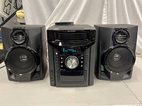 Photo of Sharp CD-BH950 mini component main unit flanked by two speakers on each side