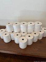 Front view of stacked thermal paper rolls