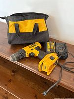 Overview of drill, charger, battery and bag