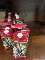 Multiple boxed mini light sets on shelf