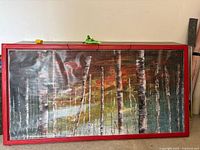 Full view of large framed birch forest print with mesh and red frame