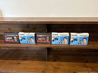 Five Mason WM-383 wireless microphone sets on shelf