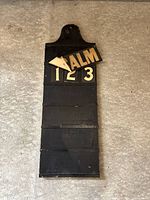 Front view showing board, grooves, number cards, detached PSALM header