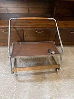 Front view of chrome frame cart with two shelves