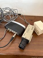 Sony Hyper HAD camera, distribution box, cables and adapter on shelf