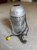 Side view showing CBC Toronto marking, yoke, clamp and cord