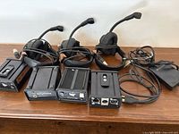 Full set: 4 headsets, 4 beltpacks, adapter interface, power supply, cables