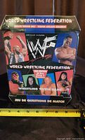 Front of factory sealed 1999 WWF World Wrestling Federation Trivia Game box showing wrestler images and branding.