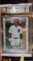 Front view of the 2020 Bowman Chrome Jasson Dominguez rookie card graded Beckett 9 with subgrades shown.