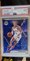 Front of 2019 Panini Mosaic Jordan Poole rookie card in PSA slab grade 9 with blue mosaic design and rookie card logo.