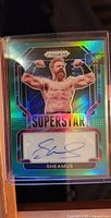 Front side of Sheamus autographed WWE trading card showing holographic design and autograph.