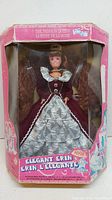 Front view of the pink box with the Erin doll inside wearing a burgundy and white lace dress. Box is visibly worn and creased.