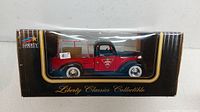 Front side view of the die-cast model in original box showing red and black 1939 Chevy pickup with Canadian Tire branding.