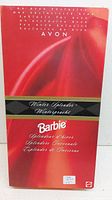 Front view of the Winter Splendor Barbie doll in its original red and black box with Avon branding.