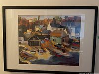 Full front view of framed painting showing coastal scene