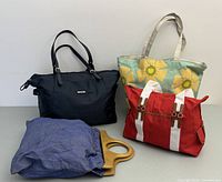 Four women's bags arranged together showing variety and style.