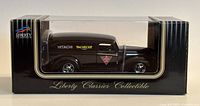Front view of the diecast model inside the packaging showing the Liberty Classics branding and visible side of the model.