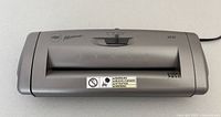 Top view of the ShredMaster SC32 portable paper shredder showing the paper slot and control switch.