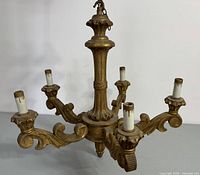 Five-arm wooden chandelier with gold finish