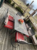 Full view of table and six chairs on deck