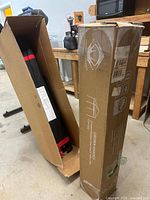 Boxed Crown Shades canopy and storage bag with visible product label showing usage instructions.