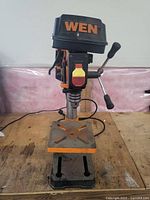 Front view of the WEN 4214T drill press showing head with speed control and handle.
