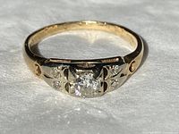 Front view showing center diamond and engraving details