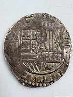 Obverse view showing Spanish royal coat of arms and mint markings