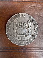 Obverse of 1749 Mexico 8 Reales pillar dollar showing crowned dual globes flanked by pillars on waves, legend 'VTRAQUE VNUM', date 1749, mintmark 'M'.