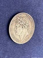 Obverse view showing laureate bust of King George IV