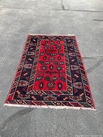 Full view of rug laid flat on concrete surface