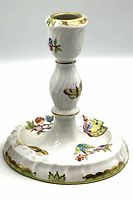 Front and side view showing hand-painted butterflies and floral pattern on base and stem