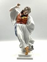 Front full-body view of the figurine showing pose and base