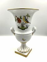 Front view showing two hand painted birds perched on foliage