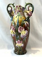 Full-height frontal view of the tall vase showing body shape, colors, and handles