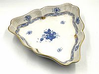 Top-down view of the triangular Herend serving dish with central and border blue floral pattern and gold trim.