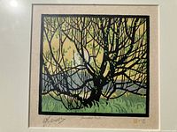Close view of linocut image showing tree branches and colour blocks