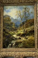 Full view of framed landscape painting against neutral backdrop