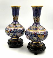 Front view of both cloisonne vases on stands