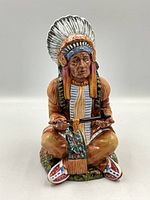 Front view of Royal Doulton "The Chief" HN2892 figurine showing full seated figure and facial features.