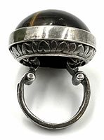 Rear view of ring showing the underside and interior of the band, bezel construction and cutout patterns.