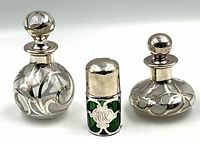 Overview of three perfume bottles side by side on white background