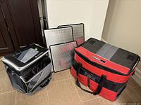 Both cooler bags and three hard movable dividers shown together for scale and condition.