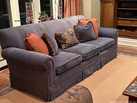 Front and side view of sofa with cushions