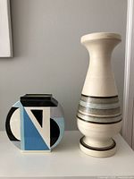 Two ceramic vases side by side showing their shapes and colors