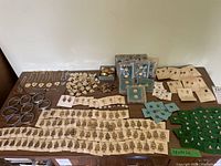 Overall table display of lapel pins, bracelets, pendants, earrings and insignia
