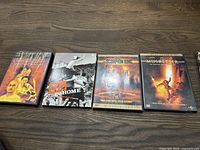 Photo of first four DVDs: Crouching Tiger Hidden Dragon, U2 Go Home, The Scorpion King, The Musketeer