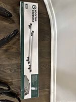 Photo showing original boxed packaging of one rooftop crossbar with North Ridge branding and product image.