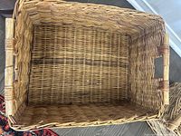Top view of large rectangular wicker basket showing woven pattern and handles